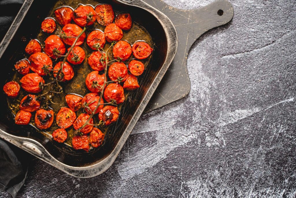 roasted cherry tomatoes in oven with olive oil