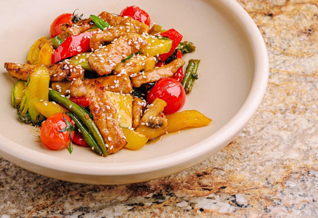 cherry tomato stir fry with vegetables in a pan