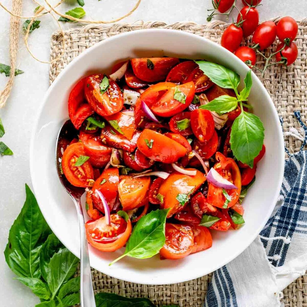 Fresh cherry tomato salad with olive oil and herbs